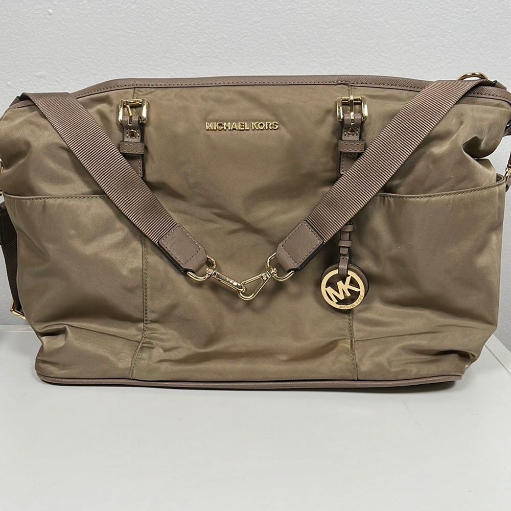 Michael Kors diaper bag, thick sturdy nylon, and spacious lots of compartments.